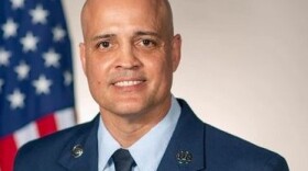 Senior Master Sergeant Jose Pagan Jr. in uniform, in front of the American flag