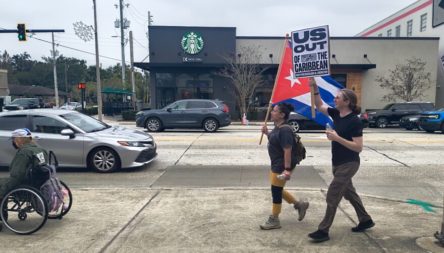 People march through Orlando’s Mills 50 neighborhood Saturday to protest against the United States’ capture of Venezuelan president Nicolás Maduro.