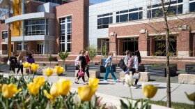 Students walk past the Rhatigan Student Center on campus at Wichita State University on April 6, 2026. Kansas Regents approved tuition hikes at Wichita State and four other state universities. 