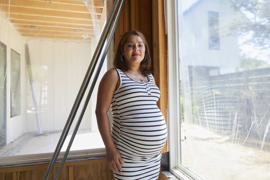 Vicky Benites poses for a portait at a location her company We Love Electric is currently working at in Austin.