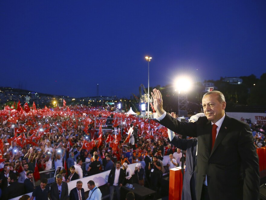 Turkey's President Recep Tayyip Erdogan waves to his supporters as he arrives to commemorate the one year anniversary of the July 15, 2016 failed coup attempt, in Istanbul, Saturday.