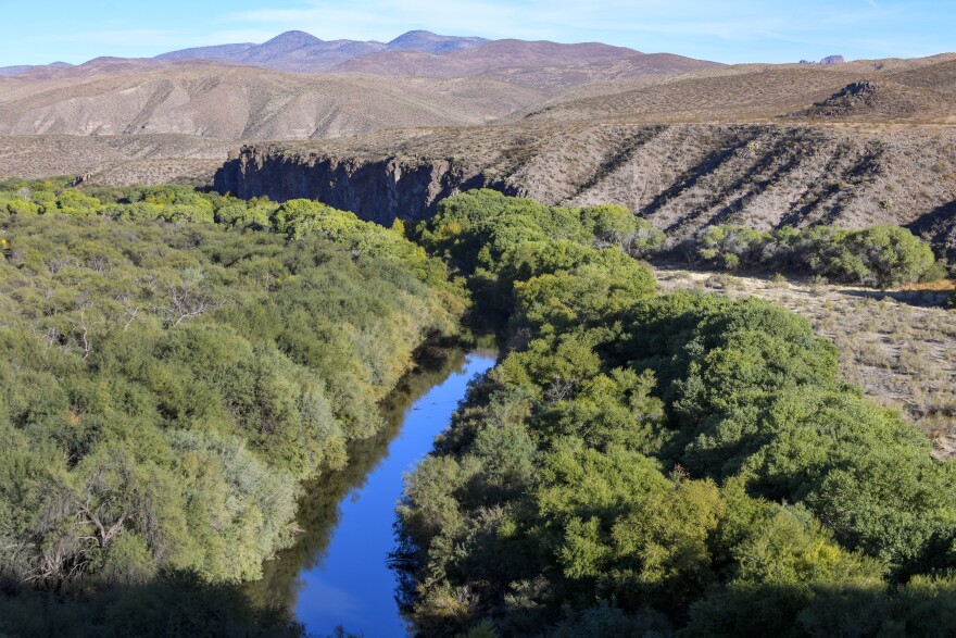 The Gila River flows near Safford, Arizona on October 30, 2020. This year, intensely dry conditions are forcing the town of Kearny to take major cutbacks. Kearny's mayor said they could cause taps to go dry as soon as July.