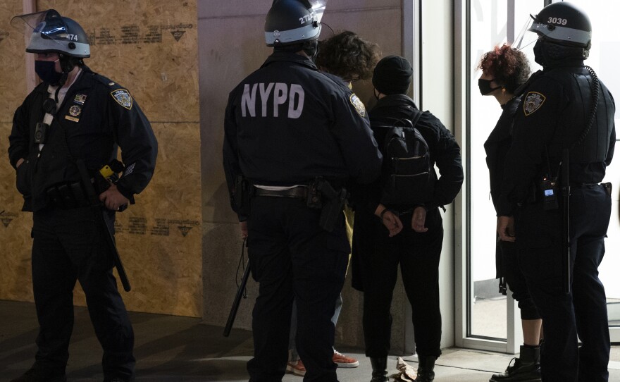 Police officers arrest some protesters in New York City on Wednesday.