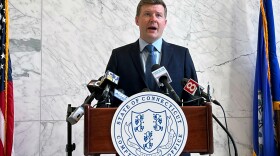 FILE: Connecticut Comptroller Sean Scanlon addresses the media at a press conference in the lobby of his office in Hartford on Dec. 18, 2024.