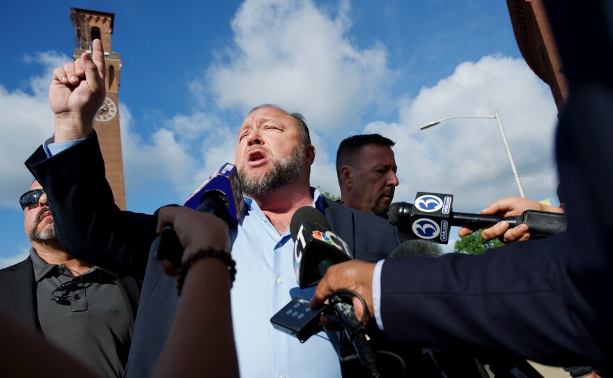 Alex Jones arrives to Waterbury Superior Court on Tuesday, September 20, 2022. He is expected to testify in a trial to determine how much he must pay in damages to the families of victims killed in the Sandy Hook Elementary School shooting.