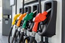 Fuel Pump, Gas Station, Gasoline.Colorful Petrol pump filling nozzles on white background , Gas station in a service in warm sunset.Head fuel vehicle refueling facility in Asia