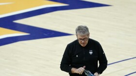 UConn head coach Geno Auriemma walks off the court after the first half of an NCAA college basketball game against Marquette Wednesday, Feb. 8, 2023, in Milwaukee.