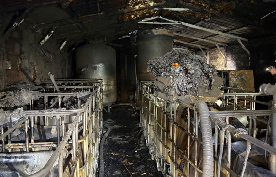 Burned distillery with charred stills in Wilkes County.