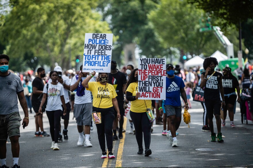 Activists march after the speeches.