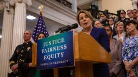 Gov. Maura Healey announces she is taking executive action to pardon misdemeanor marijuana possession convictions in Massachusetts during a press conference on the steps of the State House grand staircase. (Jesse Costa/WBUR)