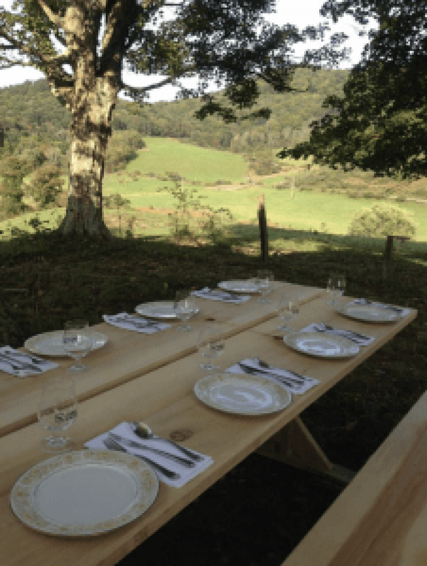 The tables were set for a dinner conversation Bourdain had with local cooks, farmers, folklorists and food justice advocates during his visit to Lost Creek Farm last fall. 