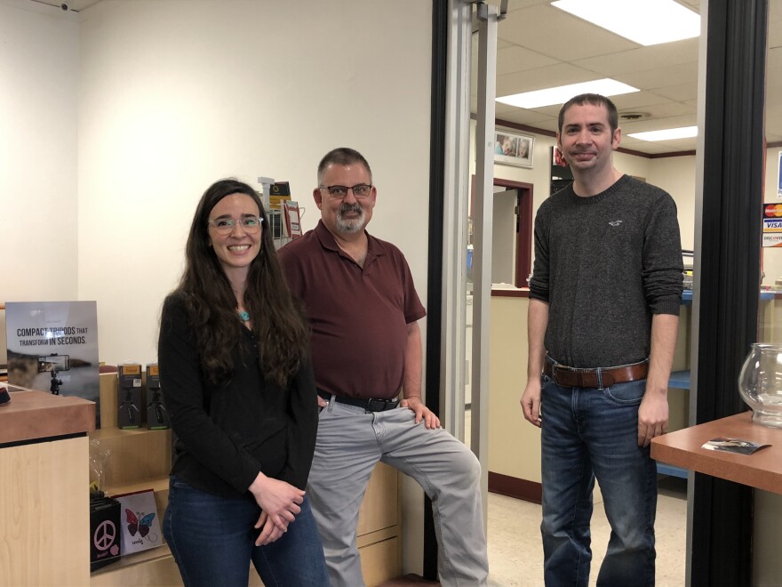 New Peoria Camera Shop owner Ava Kamm, left, poses with longtime staff members Ted Ray and Travis Carlson. Kamm recently bought the 85-year-old business and hopes to have a grand reopening by the end of May.