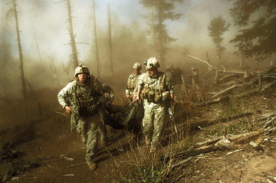 US troops carry the body of Staff Sergeant Larry Rougle, who was killed when Taliban
insurgents ambushed their squad in the Korengal Valley in Afghanistan.