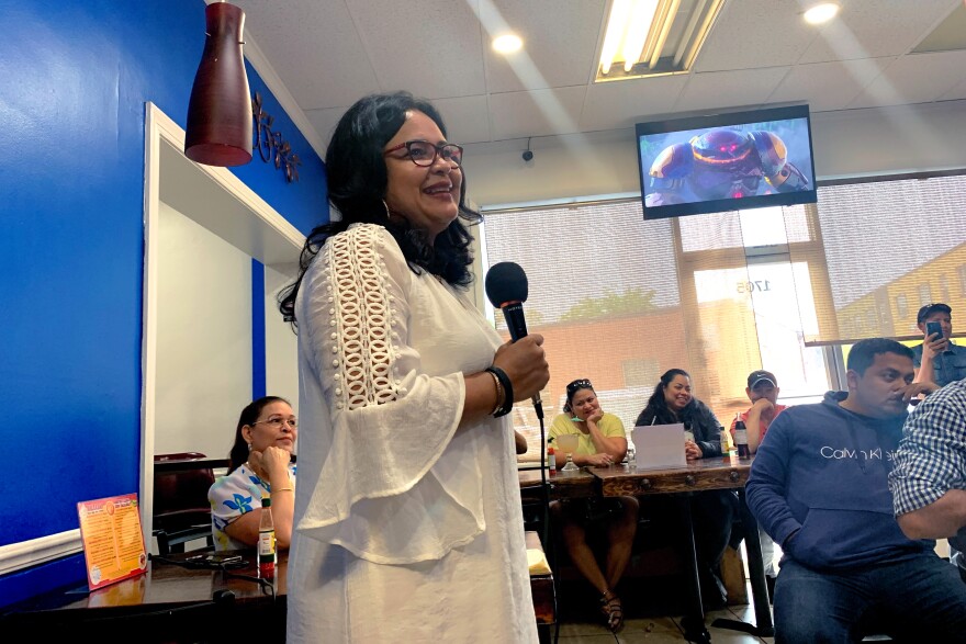 Mayor Jaqueline Trejo receives a warm welcome at El Ciruelo, a Honduran restaurant in Charlottesville, Va., in May 2022. She came to ask for donations from migrants to help the town they grew up in.