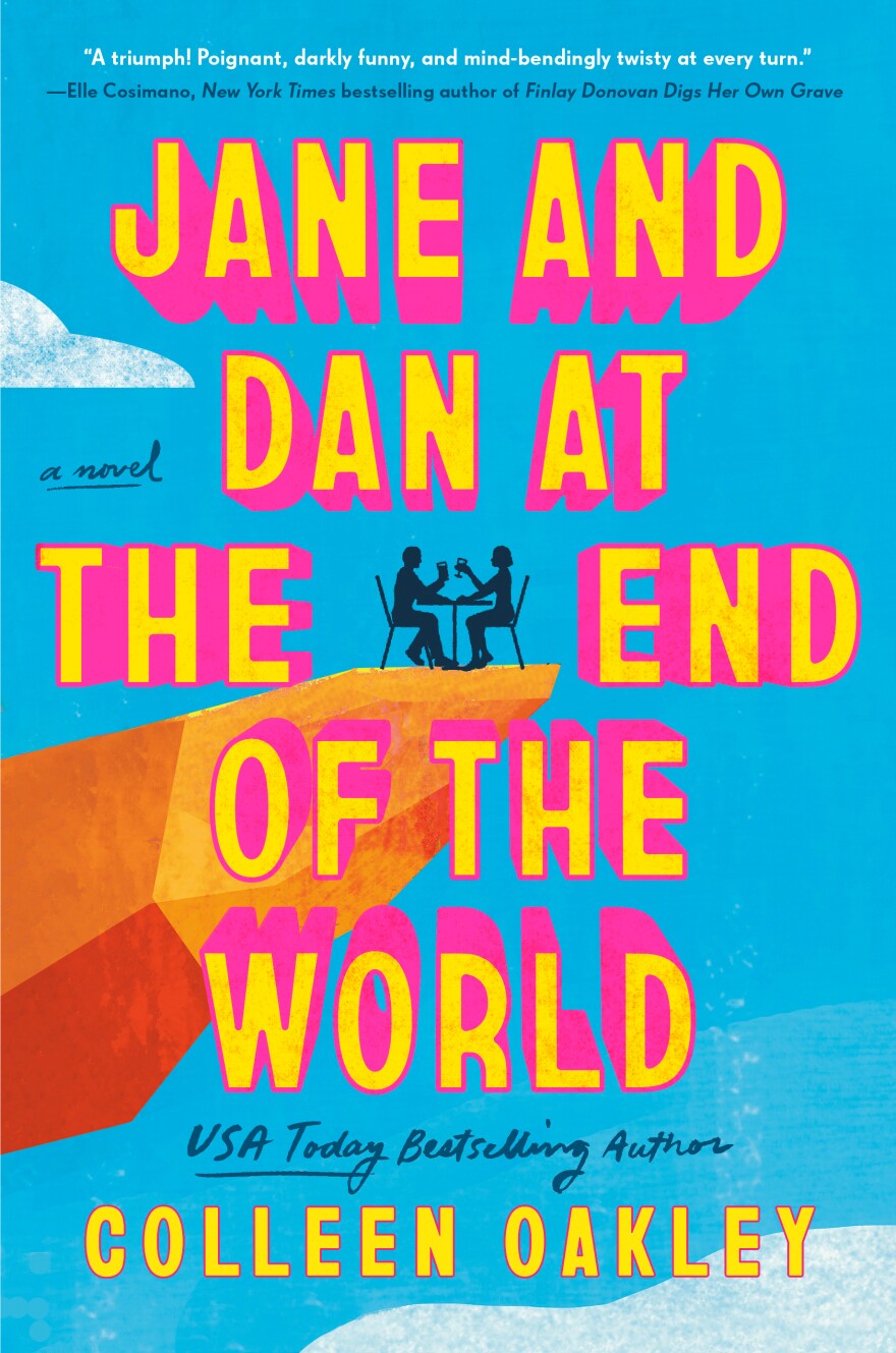Book cover image for Dan and Jane at the End of the World.  A couple sitting at a dining table on the edge of a rocky cliff, blue sky behind them.