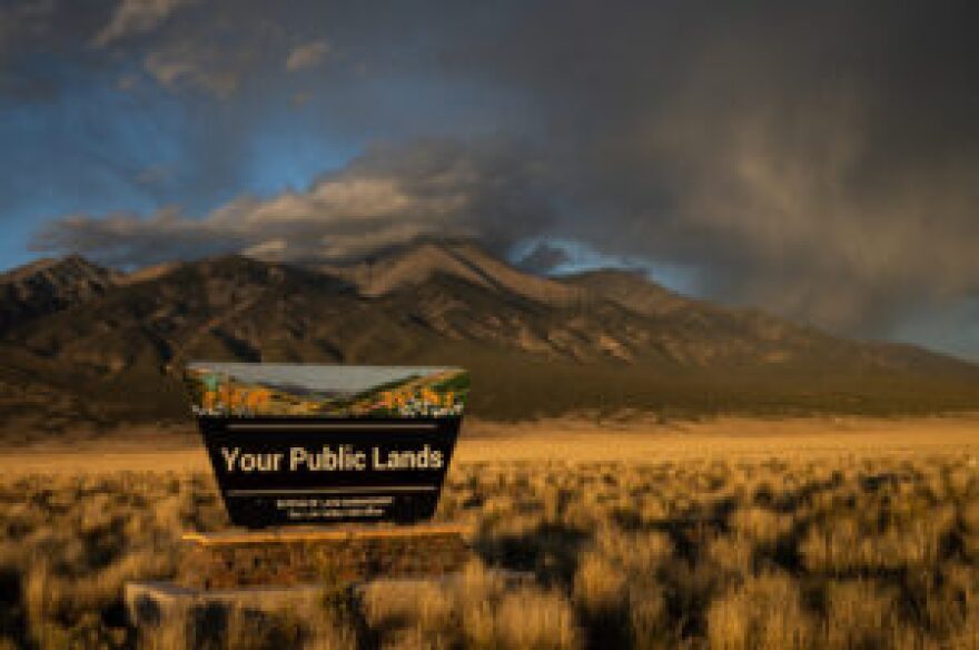 Blanca Peak in the Sangre de Cristo Mountains on the east side of San Luis Valley of Colorado, Sept. 30, 2025 provides a backdrop for a Bureau of Land Management, or BLM, sign promoting public lands.