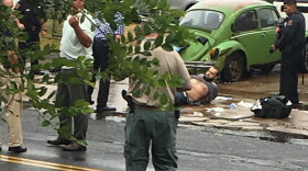 Ahmad Khan Rahami is taken into custody after a shootout with police Monday, Sept. 19, 2016, in Linden, N.J. Rahami was wanted for questioning in the bombings that rocked the Chelsea neighborhood of New York and the New Jersey shore town of Seaside Park. (Moshe Weiss via AP)