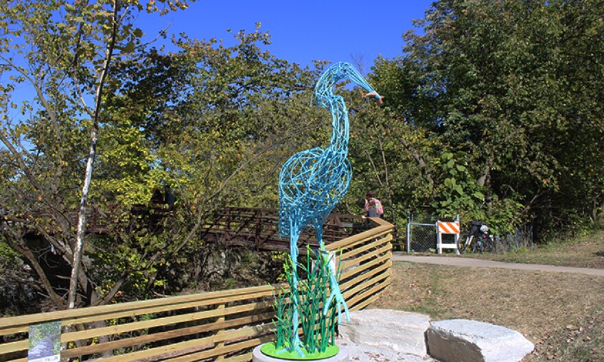 A new sculpture of a blue heron will greet passersby as they cross the Spruce Street bridge near Pleasant Run creek.