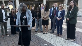 North Carolina NAACP President Deborah Dicks Maxwell speaks in front of the Hiram Ward Federal Building in Winston-Salem