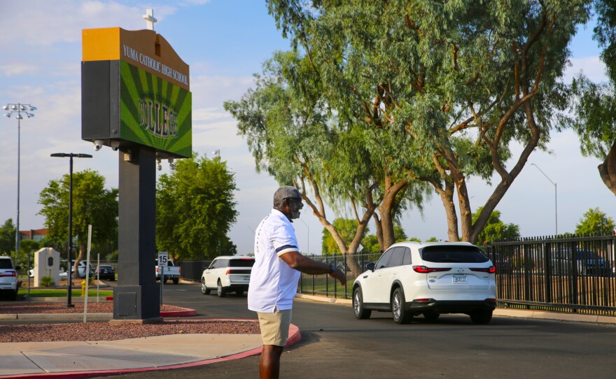 Volunteers helped direct vehicles as they filed in for drop-off Wednesday morning.