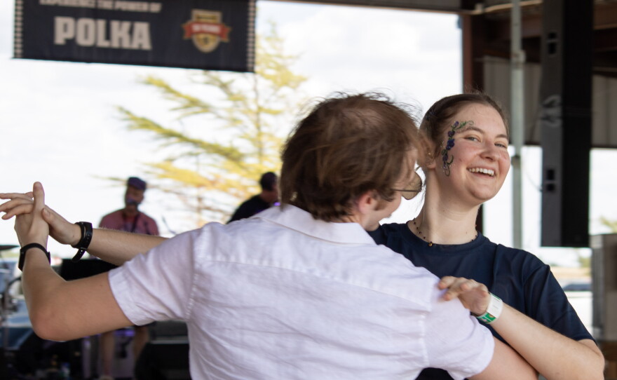 Nicole Vasicek and Tobias Hynes, both of Dallas, dance to a polka song played by the Praha Brothers at the 50th anniversary of Westfest on Saturday. Vasicek grew up in West and remembers attending Westfest with her mom to dance Polka.