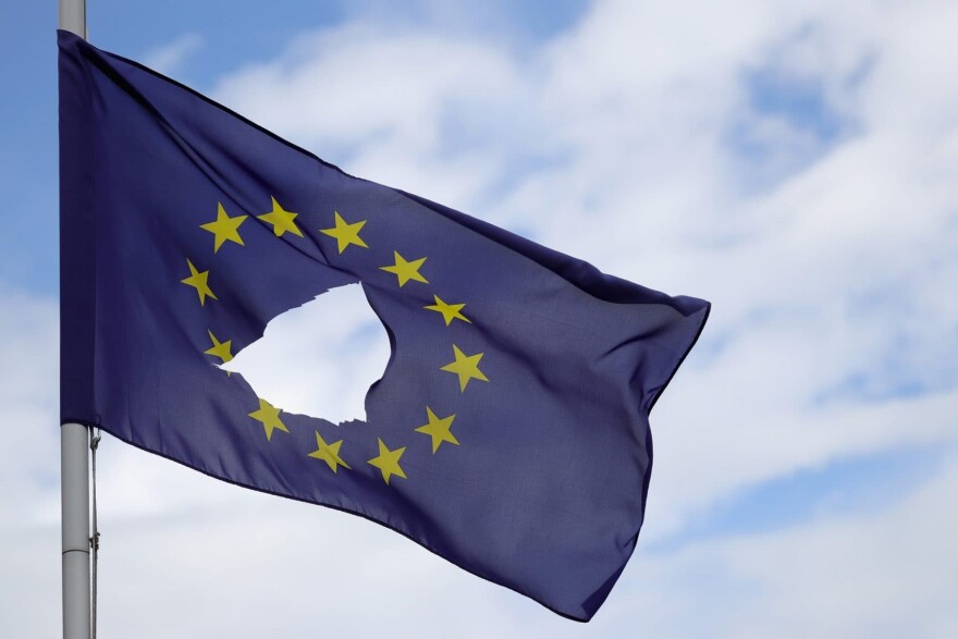 A European Union flag, with a hole cut in the middle, flies at half-mast outside a home in Knutsford Cheshire after today's historic referendum on June 24, 2016 in Knutsford, United Kingdom. (Photo by Christopher Furlong/Getty Images)