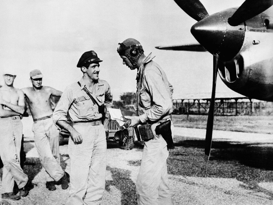 Lindbergh (right) at a U.S. military base in the Pacific in 1945. He flew more than 50 combat missions in the Pacific during World War II.