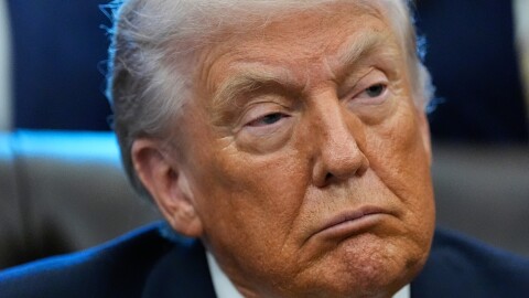 President Donald Trump listens in the Oval Office of the White House, Jan. 14, 2026, in Washington.