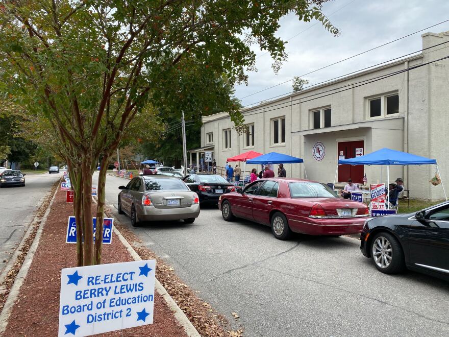 Cars line up for curbside voting outside the Recreation Center in Elizabethtown, Bladen County, on the first day of early voting.