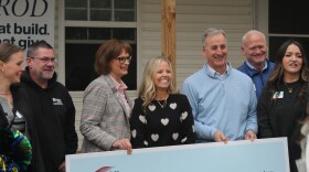Ashley McCormick stands beside some of the people who are making her home renovation and purchase possible (photo taken October 24, 2025).