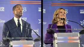 Republican John James and Democrat Jocelyn Benson stand at their lecterns during a gubernatorial debate on October 6, 2026.