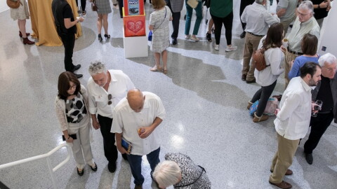 People attending an art exhibition at the Cultural Council for Palm Beach County