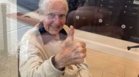 Tammy took a photo of her father through the window where they visit.