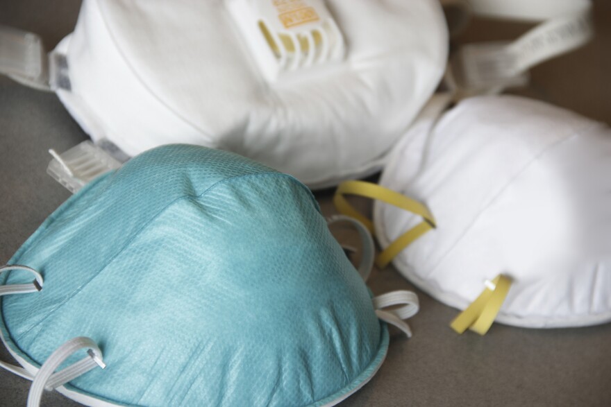 different types of face masks laying on a table