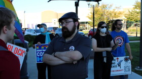 About 10 people gathered before Tuesday evening's council meeting in East Peoria's Levee Park to oppose the city's expansion of its Flock police camera program. Some were out-of-towners, whose opinions at least one councilmember said he would not consider. Ryan Gale, center, has been a vocal opponent of Flock in East Peoria. He grew up there, but now lives in nearby Creve Coeur.