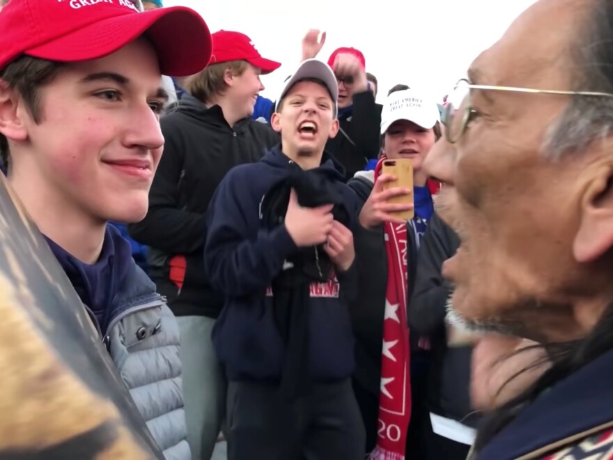 Nick Sandmann, a student from Covington Catholic High School, stands in front of Nathan Phillips, a Native American, at the Lincoln Memorial in Washington, D.C.