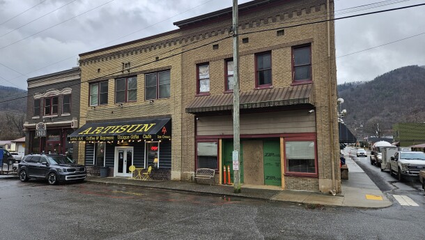 After devastating floods from Helene in 2024, downtown Hot Springs has seen many of its businesses reopen. Artisun Gallery and Cafe reopened in December after an extensive reconstruction process, while the town hall next door remains boarded up awaiting repairs.