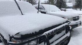 Fresh snow April 8, 2021 on a pair of pickups in East Anchorage