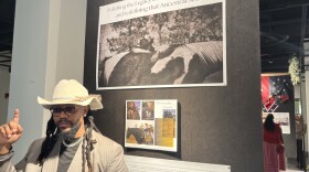 Multimedia artist Chris Diont'e discusses his exhibition, 'Ancestral Soil: The Foundation of Freeman Virginia,' during the opening reception at the Downing-Gross Cultural Arts Center in Newport News.