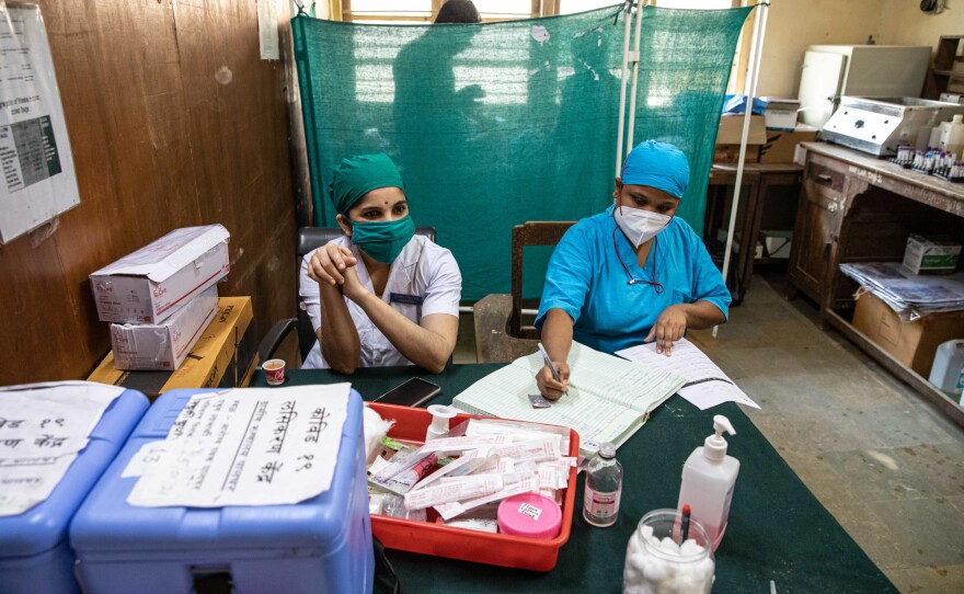 Nurses Sarika Patil (left) and Priyanka Gavai (right) in the room in the Palghar Rural Hospital where vaccines are readied.