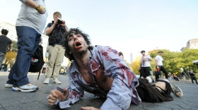 A zombie crawls through New York's Union Square during a promotion for the AMC network television series  <em>The Walking Dead.</em>