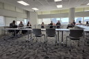 Members of the CMS superintendent search committee meet Tuesday.