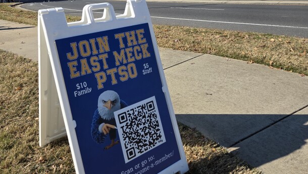 A sign for the East Mecklenburg High School PTSO, which has been organizing parent watches outside the school.