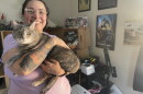 Angel Desrocher, 36, with her cat Bento. She's rented apartments since she graduated college, but she is envious of adults who decided to live at home and build up their savings.