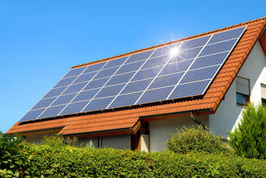 Utility companies say if lots of people suddenly start using solar panels on their roofs, it would cause a huge disruption to the electric system.