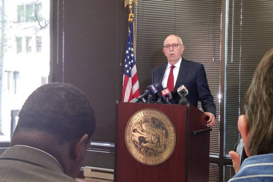 Marion County Prosecutor Terry Curry speaks to the press.