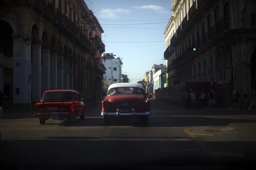 18: Two red cars