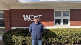 man standing in front of building
