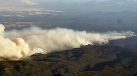 Heavy smoke rolls off of a wildfire burning in Central Oregon, July 27, 2026. As of Tuesday, large fires covered more than 1.1 million acres, according to the Oregon Department of Forestry.c