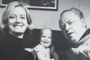 Six-month-old Andrea Hoag, center, and her parents, Mary Tuven and Charles Kelso Hoag, pose for a 1971 family Christmas card picture.